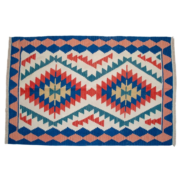 Woven in the traditional workshops of Oushak during the 1980s, this striking flatweave kilim exemplifies the dynamic...