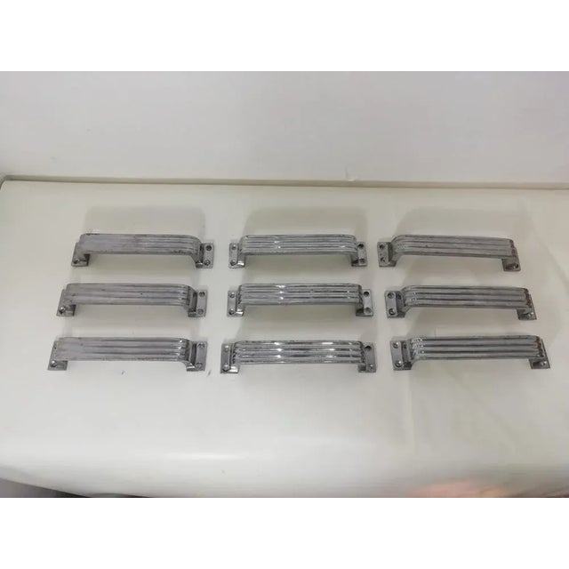 Set of nine original vintage aluminum handles. Highest quality material. Never used. Good general conditions.