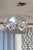 A quintessential example of mid-century modern design, this Arco-style floor lamp features a striking chrome globe shade...