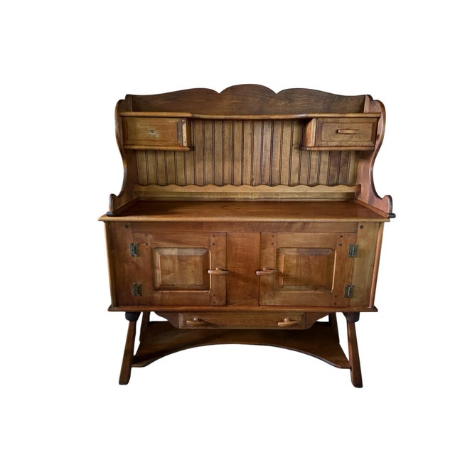 Antique American baker’s cabinet in a classical wooden cupboard form. Measures 50 W × 19 D × 57 H in. Maker attribution is...