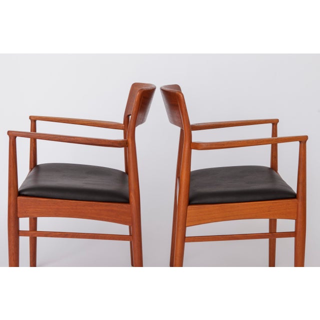 Set of 2 Armchairs by Henning Kjærnulf for Korup Stolefabrik, 1960s A beautiful pair of Danish armchairs designed by...