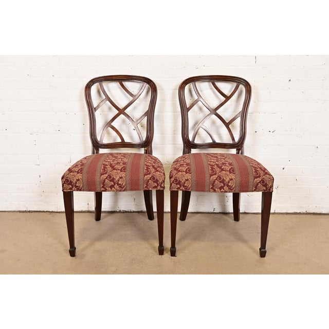 A gorgeous pair of Federal or Hepplewhite style side chairs or dining chairs By Kindel Furniture USA, Circa 1980s Carved...