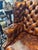 Very handsome vintage tufted leather wingback chair in the Chesterfield style. It is the perfect classic cognac brown...