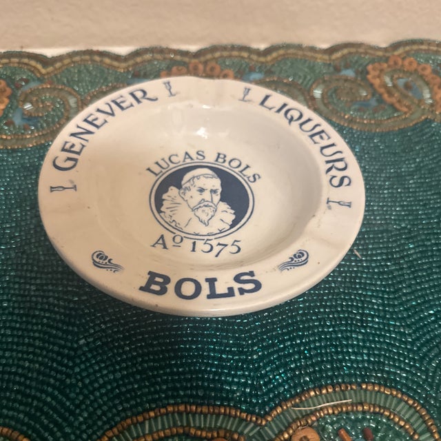 Add a touch of vintage European barware charm to your home with this collectible ceramic advertising ashtray, crafted for...