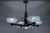 French Art Deco chandelier by Ezan with opalescent glass shades, circa 1930s. Elegant chandelier featuring five signed...