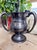 An antique trophy cup with three handles, engraved on one side to read: PRESENTED BY A FOSSIL TO RALPH H McGRAW PUBLISHER...