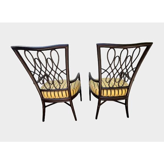 A beautiful pair of script armchairs designed by Barbara Barry for The McGuire Company. Color: Dark Tobacco Fabric:...
