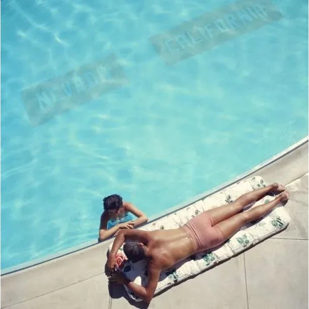 Lake Tahoe Couple 1959 A couple at a swimming pool near Lake Tahoe, California, 1959. The line on the bottom of the pool...