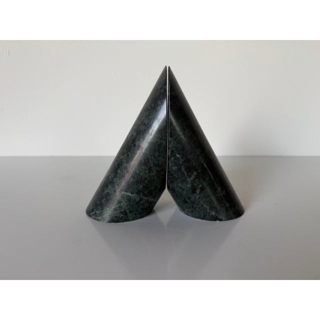 Striking pair of vintage sculptural bookends crafted from solid dark green marble with natural black, forest green, and...