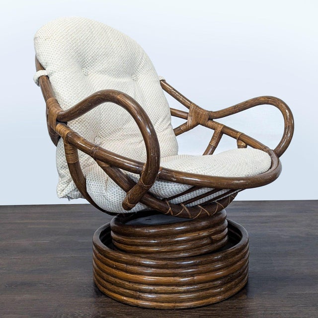Add a cozy touch to your lounge area with this vintage rattan chair. The sturdy circular rattan frame and soft, light-...