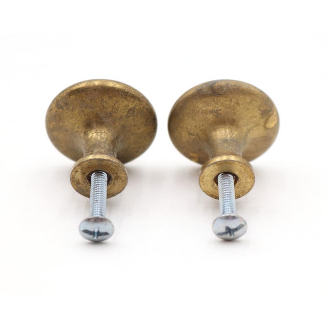 Vintage Classic cabinet or drawer knobs made of patina brass with a round shape. Mounting screws are included. Good...