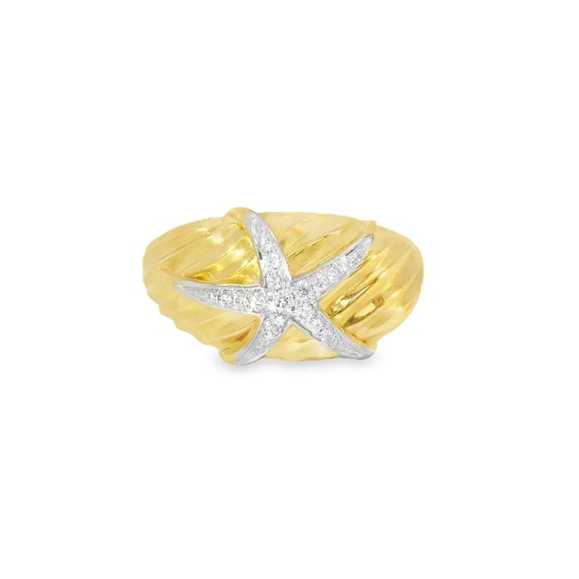 Unique 14K yellow gold cocktail ring featuring a beautiful starfish design adorned with brilliant round diamonds totaling...