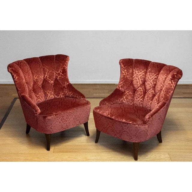 Pair of 1940s Swedish Napoleon III–style armchairs, upholstered in rich brick-red (brique) velvet jacquard fabric. These...