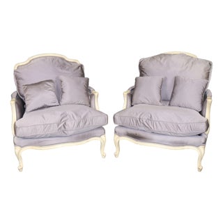 Pair Louis XV Style Oversized Creme Painted and Upholstered Bergère Chairs For Sale
