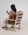 This piece makes its impression through natural bleached oak, taupe cushion. It was made in France during 1970s, a lineage...