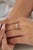 This crisscross double band ring showcases 0.65 carats of natural diamonds, set in 14K yellow gold. The diamonds are set...