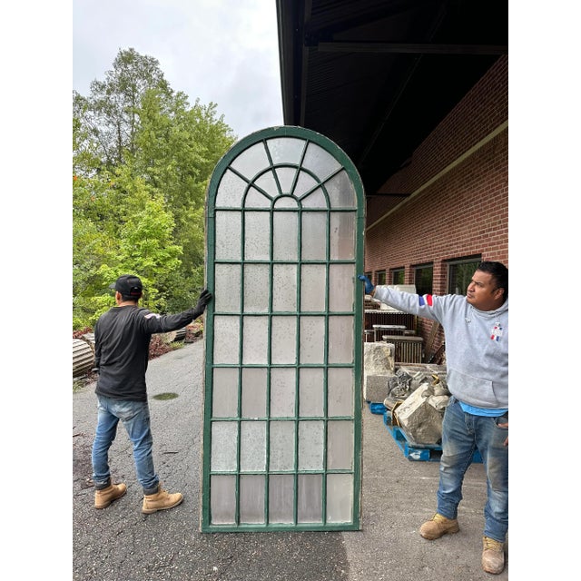 Antique, two-part arched double hung windows of impressive height having wood mullions and frame. Glass is opaque. Perfect...