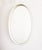 An elegant oval-shaped vintage 1970s minimalist mirror. This timeless design classic is 80 cm in height and 50 cm wide,...