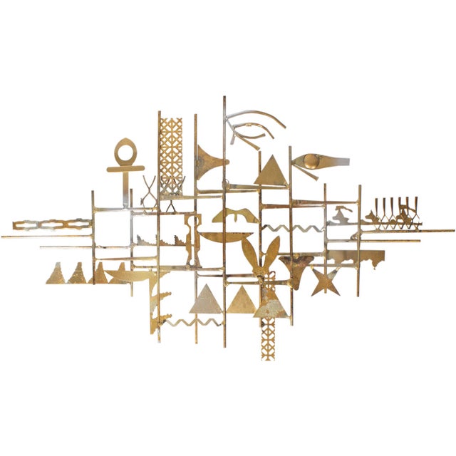A 1960s Egyptian-inspired metal wall sculpture designed by American sculpture artist William Bowie (1926-1994). This metal...