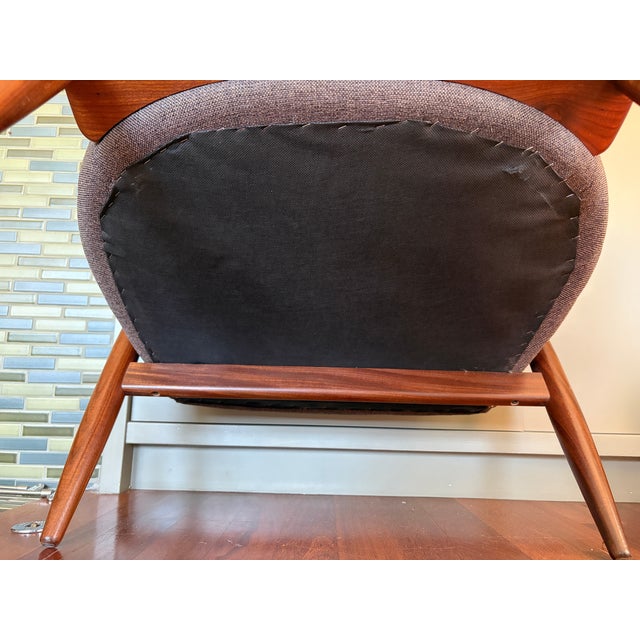 An exceptional, striking pair of mid-century modern sculptural barrel-back lounge chairs, circa 1960s. Embodying the...