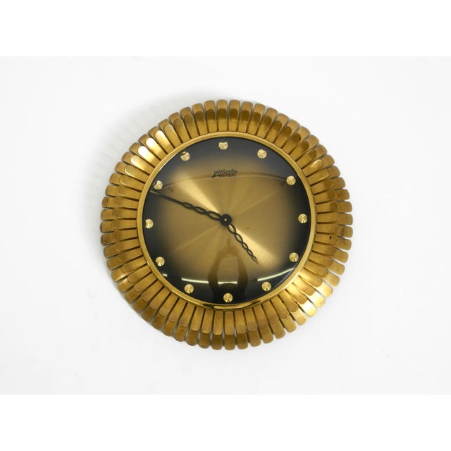 Beautiful original 1950s Sunburst Atlanta Univers wall clock made of heavy brass. Made in Germany. It has a mechanical...