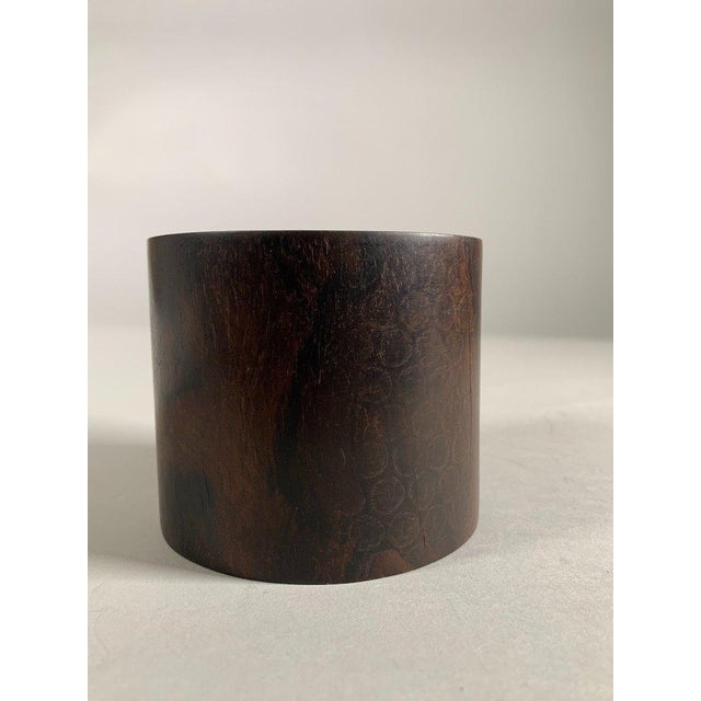 "Bitong" Chinese brush pot, 19th century, Qing dynasty. Cylindrical shape in zitan wood with a "ghost eyes" motif....
