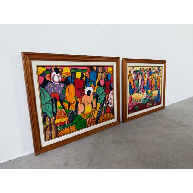 Colorful vintage Haitian folk art oil on canvas painting depicting a lively outdoor market scene filled with stylized...