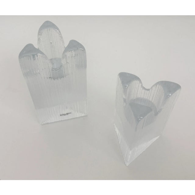 Set of two ice-style cast glass votive candle holders designed by Anna Ehrner for by Kosta Boda. Produced in Sweden...