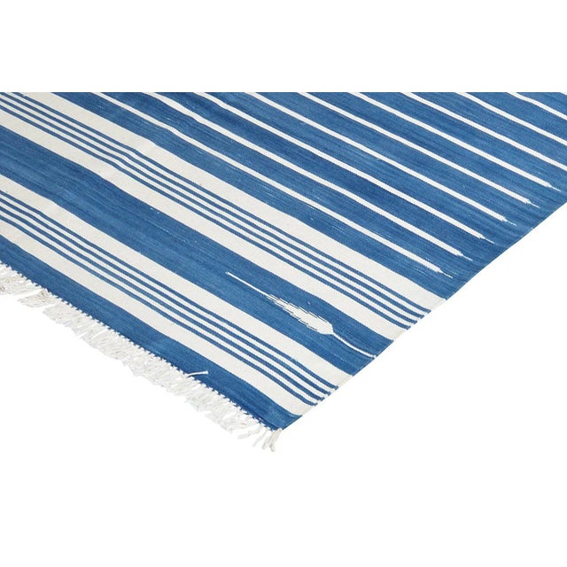 Presenting our Regal Dalia Collection! Made from naturally dyed 100% cotton yarn, these dhurrie rugs have been handwoven...