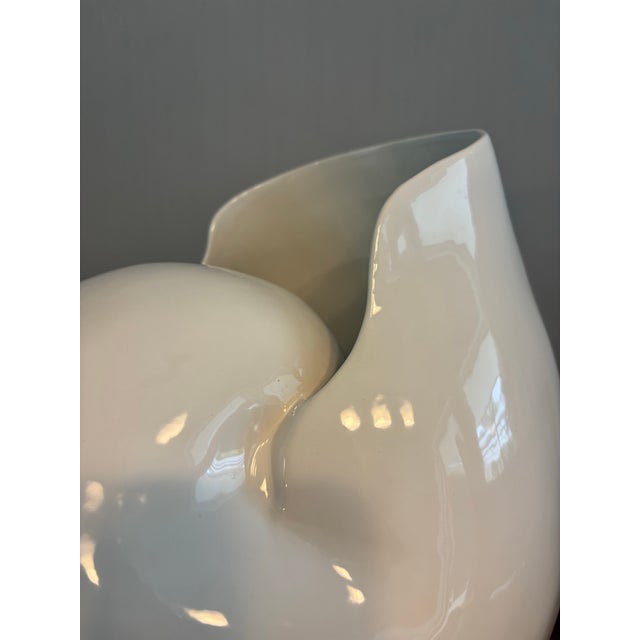 Exceptionally beautiful large scale Italian Porcelain nautilus shell vase. Beautiful curves catch and reflect light. A...