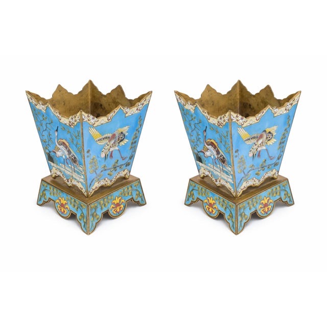 A fine pair of Chinese 19th Century Cloisonne jardenieres circa 1880. The jardenieres with a light blue primary ground...