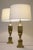 A bold and impressive matched pair of vintage Atomic Modern Brass stylized Urn table lamps designed by Tony Paul and...