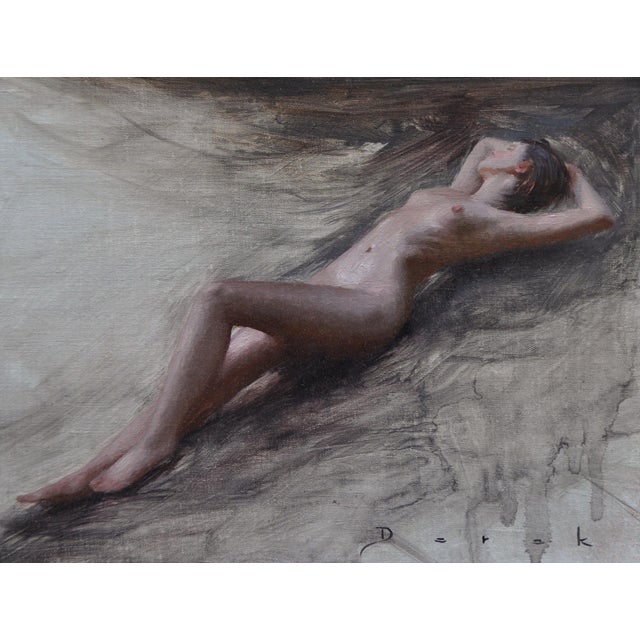 This oil painting on linen captures a serene outdoor scene featuring a reclining nude figure, bathed in soft, natural...