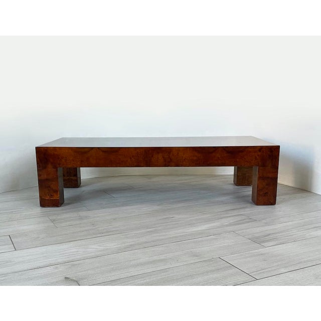 A distinctive 1950s low coffee table, polished and made entirely of elm burl. dimensions: h 30.5 x d 59 x w 120 cm period:...