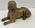 Bronze figure of a sphinx from early 1900's characterized by its detailed pharaonic headdress and recumbent posture