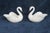 This lovely Pair of Swan Figurines is made of porcelain. Both of these darling miniatures are marked on the bottom as...