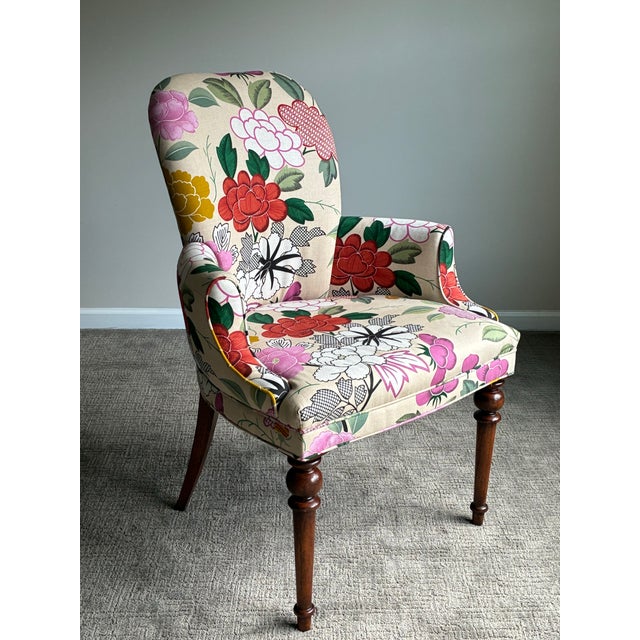 An extraordinary pair of Baker Furniture accent lounge chairs featuring a striking high-end botanical upholstery in an...