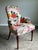 An extraordinary pair of Baker Furniture accent lounge chairs featuring a striking high-end botanical upholstery in an...