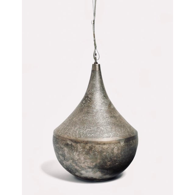 This fantastic Moroccan made pendant light hung in the New York apartment of Sex in The City’s Carrie and Mr. Big, John...