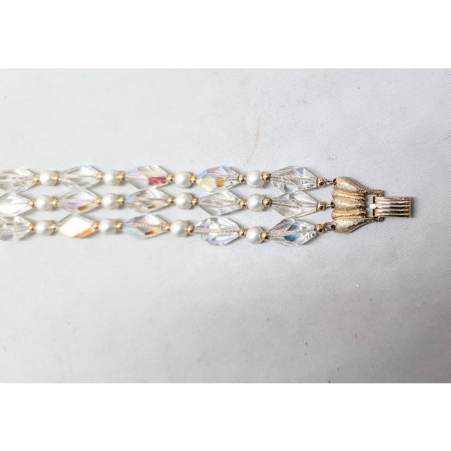 1960s 3-strand goldtone oblong faceted aurora borealis beads with faux-pearls and small goldtone round spacer beads...