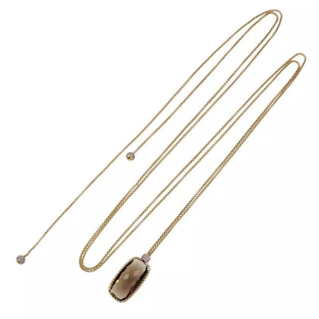 This authentic chic long chain and pendant is by David Yurman, it is crafted from 18k yellow, white and rose gold...