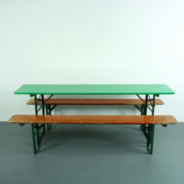 Lovely biergarten pine beer table which has been painted in green with benches in their original rust colour paint. Can be...