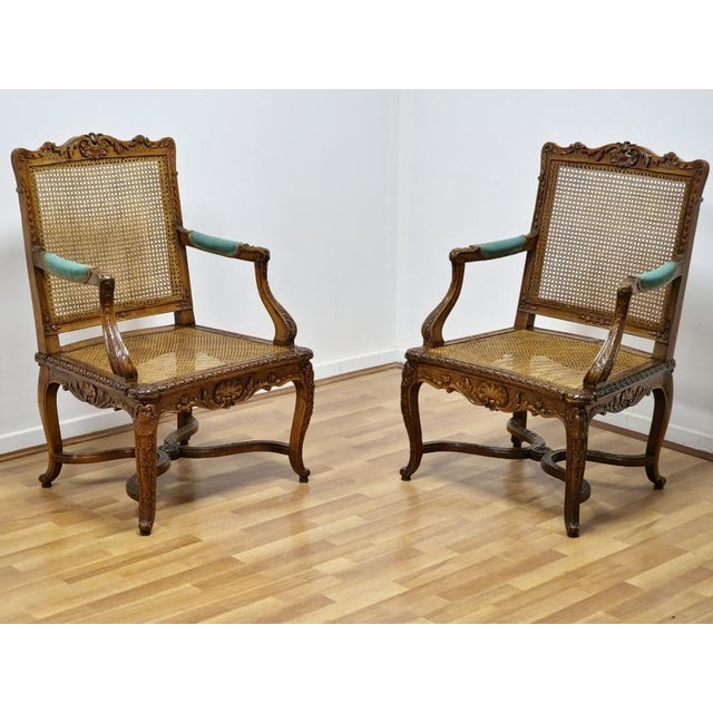 An elegant pair of canned fauteuils à la Reine in the late Regence/early Louis XV style, made in France around 1740. These...