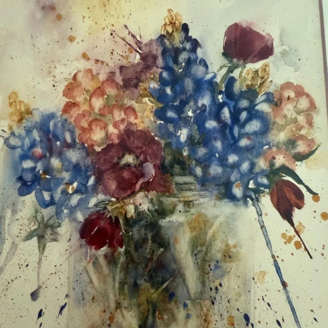 Mixed flowers and bluebonnets in a glass jar. This floral watercolor in a gold frame is by Lynn Turnbow, San Antonio,...
