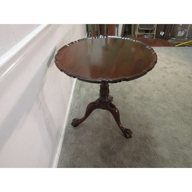 Item: Legacy solid mahogany pie crust lamp table Age: 1980's. Details: Carved center pedistal. Measurements: 28.75 round...
