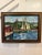 A charming vintage signed oil painting depicting two schooners moored along a working harbor waterfront. Richly painted in...