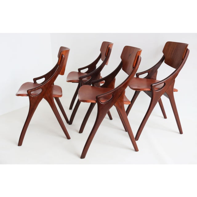 An elegant and highly sculptural set of four Danish Modern dining chairs designed by Arne Hovmand-Olsen and produced by...