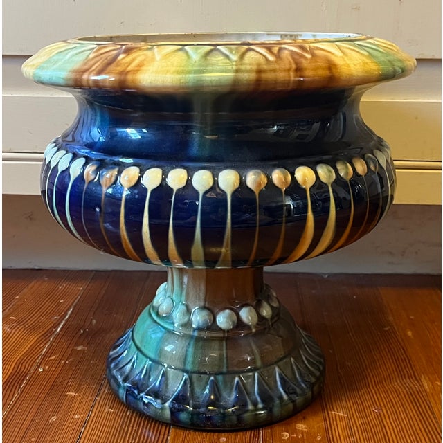 Antique 19th century French Majolica urn planter or flower pot. Decorated in shades of blue, green and brown in the...
