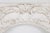 Louis XV style rectangular stucco wood panel with an oval-shaped central hole surrounding by carved ornament such as...