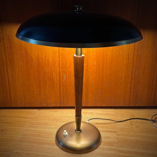 A modernist table lamp, model 8453, produced by the Swedish manufacturer Boréns in the 1930s. This striking piece captures...